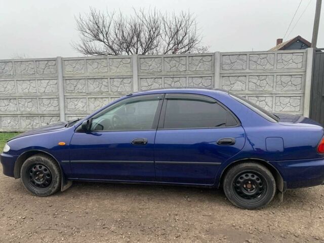 Синий Мазда 323, объемом двигателя 1.5 л и пробегом 419 тыс. км за 2500 $, фото 6 на Automoto.ua