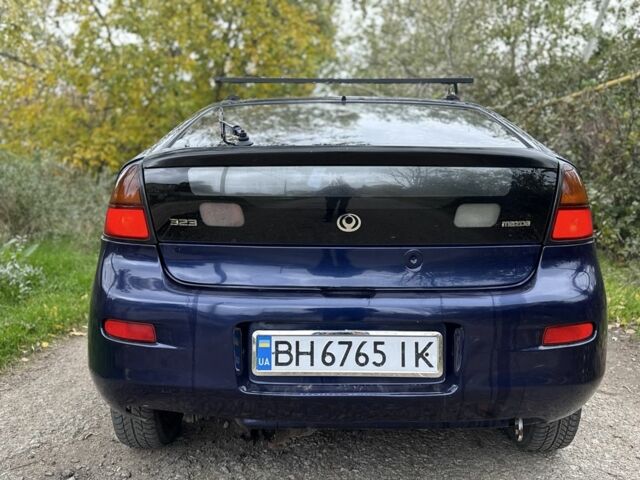 Синій Мазда 323, об'ємом двигуна 1.5 л та пробігом 200 тис. км за 1000 $, фото 4 на Automoto.ua