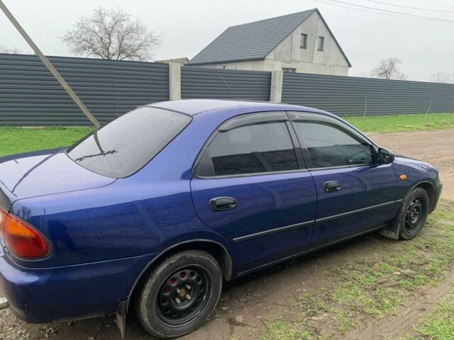 Синий Мазда 323, объемом двигателя 1.5 л и пробегом 419 тыс. км за 2500 $, фото 7 на Automoto.ua