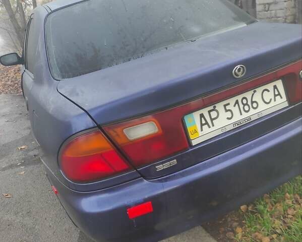 Синий Мазда 323, объемом двигателя 1.5 л и пробегом 295 тыс. км за 2300 $, фото 1 на Automoto.ua