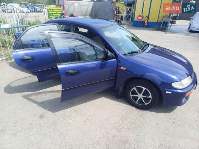 Синий Мазда 323, объемом двигателя 1.5 л и пробегом 295 тыс. км за 2300 $, фото 15 на Automoto.ua