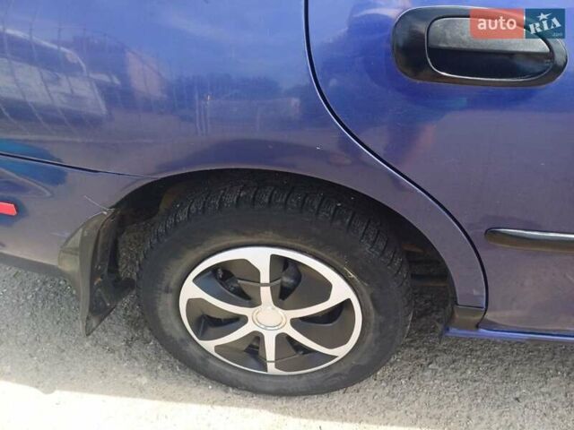 Синий Мазда 323, объемом двигателя 1.5 л и пробегом 295 тыс. км за 2300 $, фото 13 на Automoto.ua