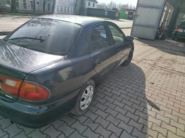 Синий Мазда 323, объемом двигателя 0 л и пробегом 287 тыс. км за 1700 $, фото 6 на Automoto.ua