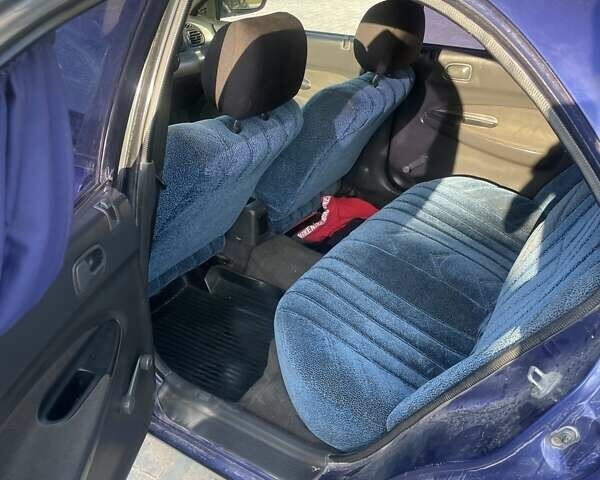 Синий Мазда 323, объемом двигателя 1.5 л и пробегом 380 тыс. км за 1400 $, фото 6 на Automoto.ua