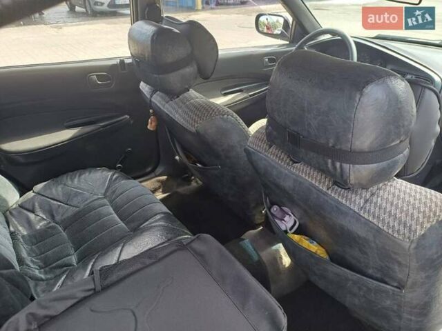 Синий Мазда 323, объемом двигателя 1.5 л и пробегом 295 тыс. км за 2300 $, фото 6 на Automoto.ua