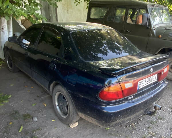 Синій Мазда 323, об'ємом двигуна 1.3 л та пробігом 395 тис. км за 1750 $, фото 1 на Automoto.ua