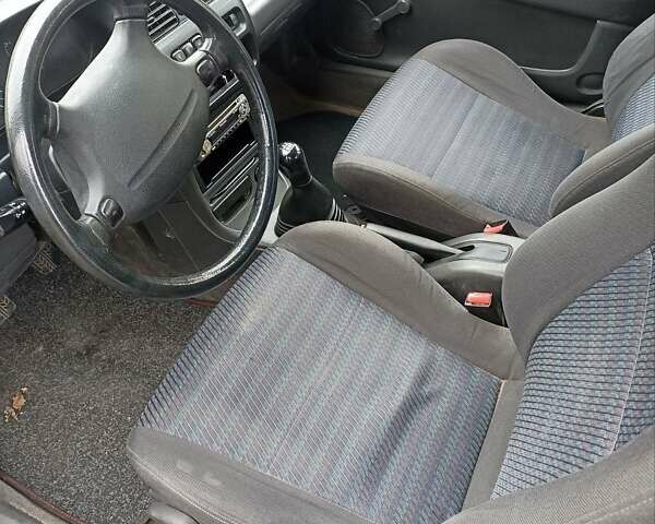 Синий Мазда 323, объемом двигателя 1.49 л и пробегом 250 тыс. км за 1450 $, фото 5 на Automoto.ua