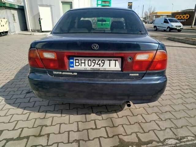 Синий Мазда 323, объемом двигателя 0 л и пробегом 287 тыс. км за 1700 $, фото 5 на Automoto.ua