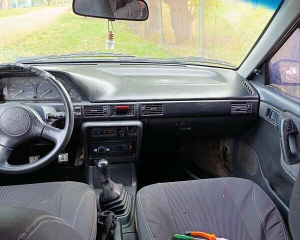 Синий Мазда 323, объемом двигателя 1.69 л и пробегом 250 тыс. км за 750 $, фото 1 на Automoto.ua