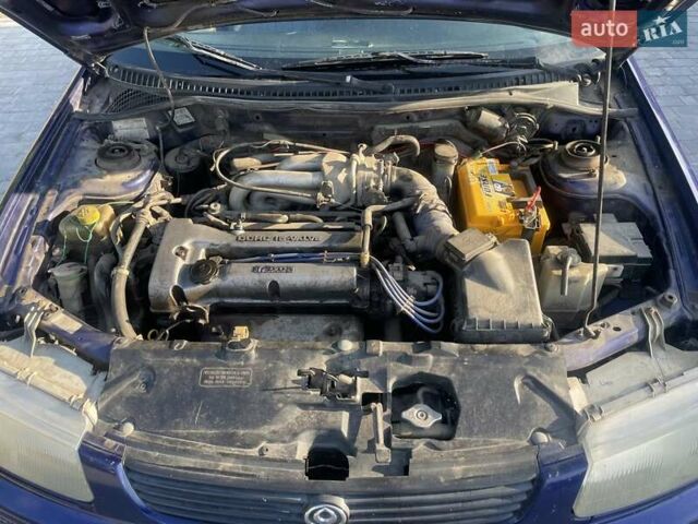 Синий Мазда 323, объемом двигателя 1.5 л и пробегом 380 тыс. км за 1400 $, фото 7 на Automoto.ua