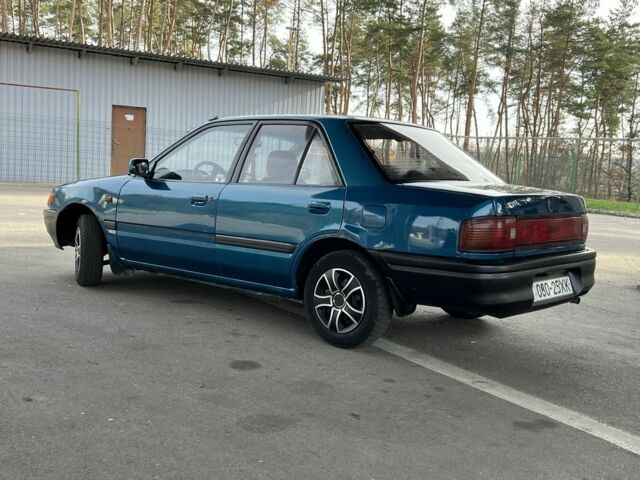 Синий Мазда 323, объемом двигателя 1.6 л и пробегом 250 тыс. км за 1900 $, фото 2 на Automoto.ua
