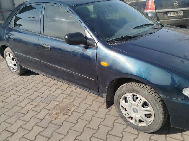Синий Мазда 323, объемом двигателя 0 л и пробегом 287 тыс. км за 1700 $, фото 2 на Automoto.ua