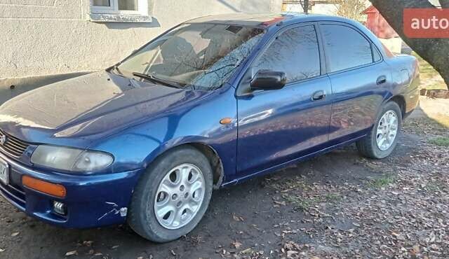 Синий Мазда 323, объемом двигателя 1.5 л и пробегом 400 тыс. км за 1300 $, фото 11 на Automoto.ua