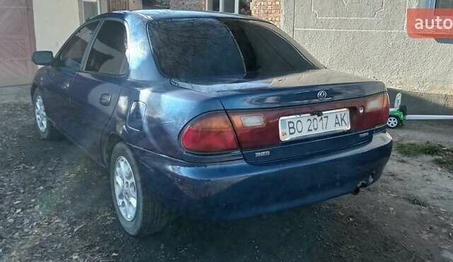 Синий Мазда 323, объемом двигателя 1.5 л и пробегом 400 тыс. км за 1300 $, фото 5 на Automoto.ua