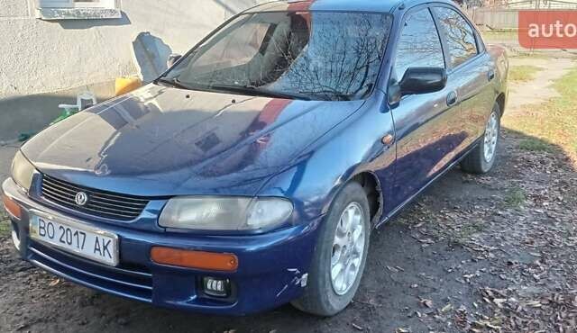 Синий Мазда 323, объемом двигателя 1.5 л и пробегом 400 тыс. км за 1300 $, фото 4 на Automoto.ua