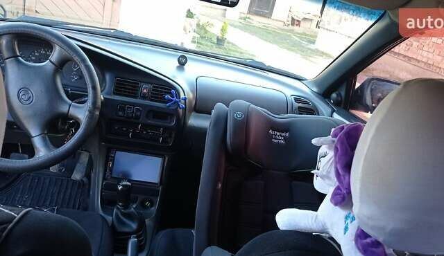 Синий Мазда 323, объемом двигателя 1.5 л и пробегом 400 тыс. км за 1300 $, фото 1 на Automoto.ua