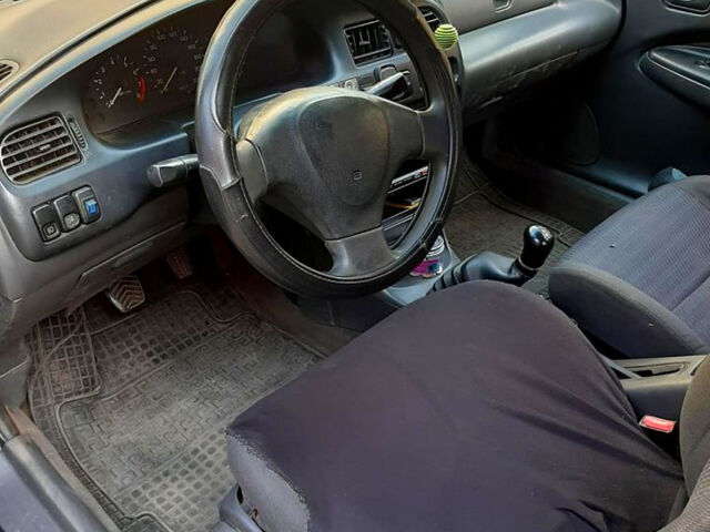 Синий Мазда 323, объемом двигателя 1.5 л и пробегом 402 тыс. км за 2500 $, фото 5 на Automoto.ua