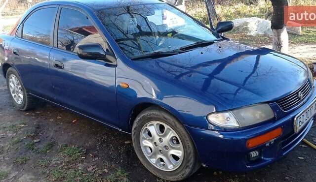 Синий Мазда 323, объемом двигателя 1.5 л и пробегом 400 тыс. км за 1300 $, фото 3 на Automoto.ua