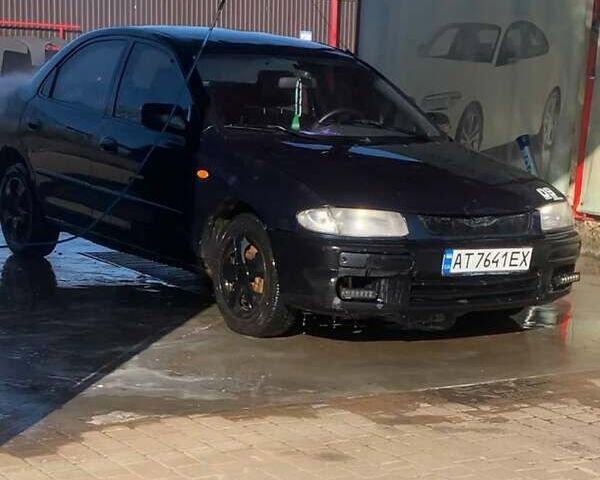 Синий Мазда 323, объемом двигателя 1.5 л и пробегом 500 тыс. км за 700 $, фото 1 на Automoto.ua