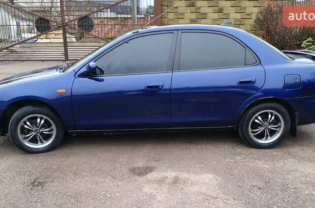 Синий Мазда 323, объемом двигателя 1.5 л и пробегом 342 тыс. км за 2600 $, фото 5 на Automoto.ua