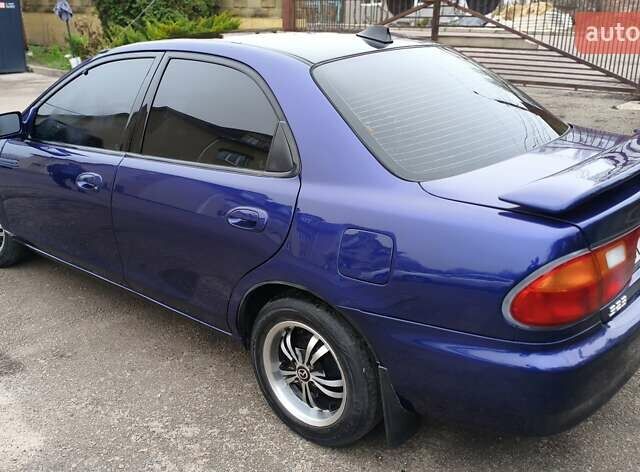 Синий Мазда 323, объемом двигателя 1.5 л и пробегом 342 тыс. км за 2600 $, фото 2 на Automoto.ua