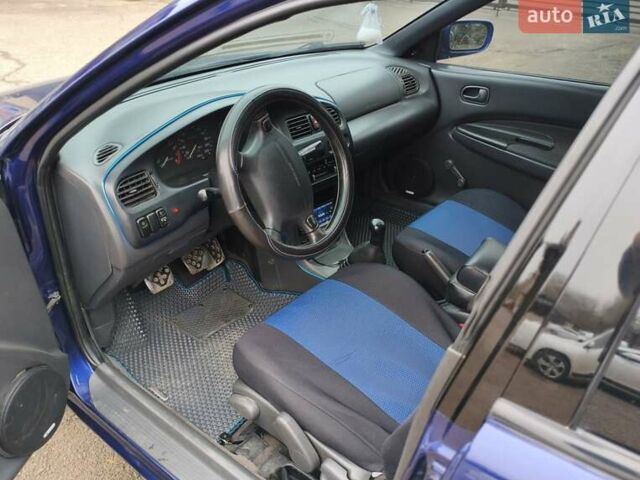 Синий Мазда 323, объемом двигателя 1.5 л и пробегом 342 тыс. км за 2600 $, фото 7 на Automoto.ua