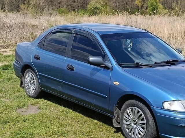Синій Мазда 323, об'ємом двигуна 1.5 л та пробігом 312 тис. км за 2200 $, фото 2 на Automoto.ua