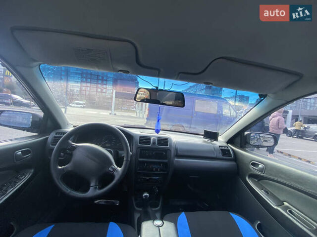 Синий Мазда 323, объемом двигателя 1.5 л и пробегом 330 тыс. км за 3000 $, фото 13 на Automoto.ua