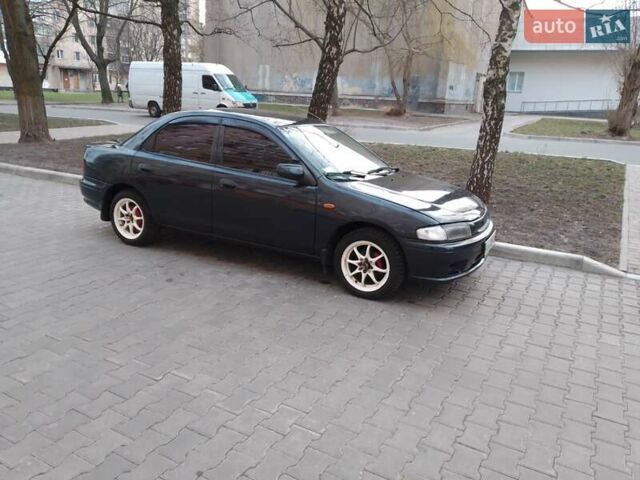 Синій Мазда 323, об'ємом двигуна 1.5 л та пробігом 309 тис. км за 2750 $, фото 12 на Automoto.ua