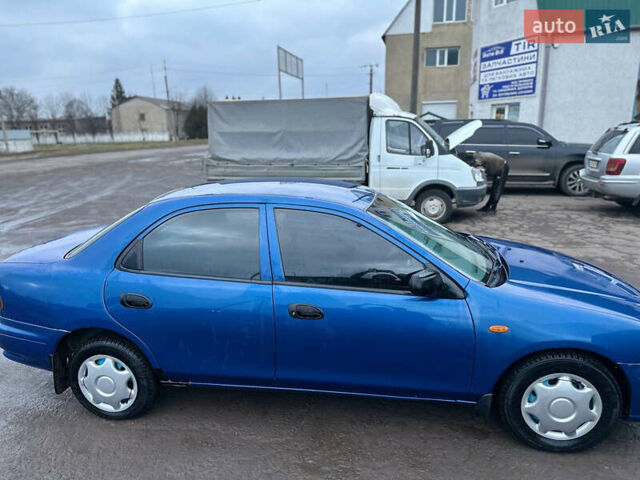 Синий Мазда 323, объемом двигателя 1.5 л и пробегом 330 тыс. км за 2200 $, фото 3 на Automoto.ua