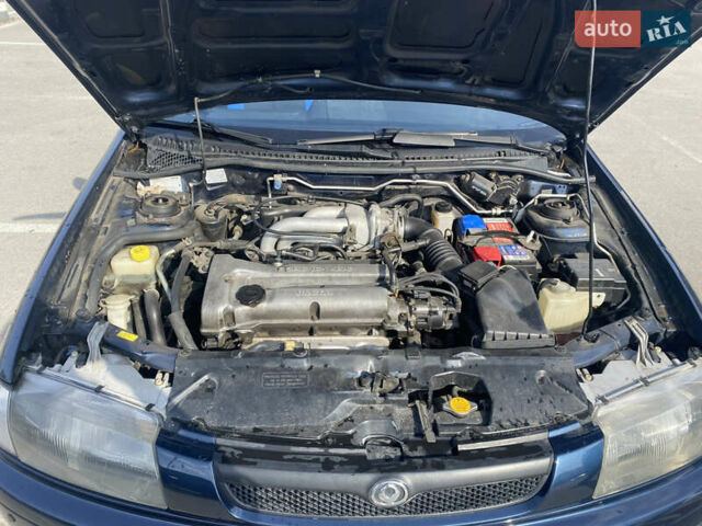 Синий Мазда 323, объемом двигателя 1.5 л и пробегом 330 тыс. км за 3000 $, фото 16 на Automoto.ua