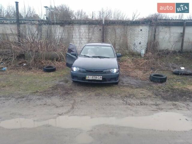 Синій Мазда 323, об'ємом двигуна 1.5 л та пробігом 309 тис. км за 2750 $, фото 6 на Automoto.ua