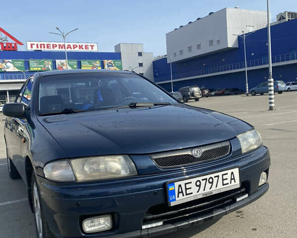 Синий Мазда 323, объемом двигателя 1.5 л и пробегом 330 тыс. км за 3000 $, фото 1 на Automoto.ua