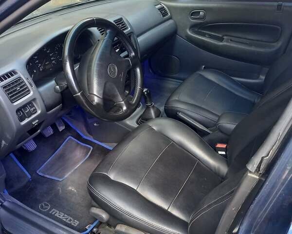 Синий Мазда 323, объемом двигателя 1.8 л и пробегом 443 тыс. км за 3300 $, фото 4 на Automoto.ua