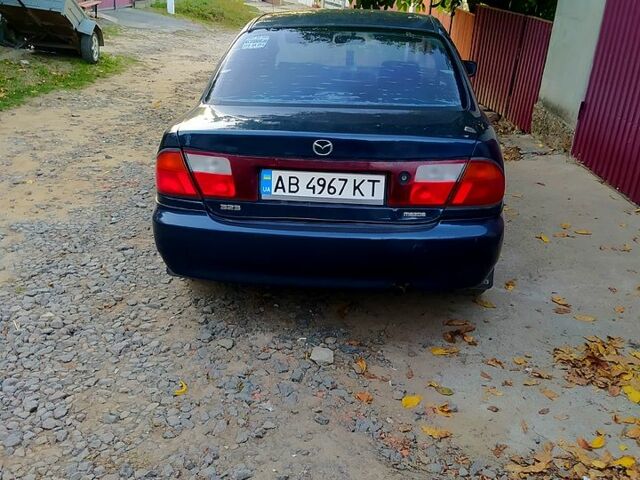 Синій Мазда 323, об'ємом двигуна 1.5 л та пробігом 0 тис. км за 1500 $, фото 1 на Automoto.ua