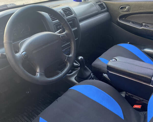 Синий Мазда 323, объемом двигателя 1.5 л и пробегом 330 тыс. км за 3000 $, фото 19 на Automoto.ua