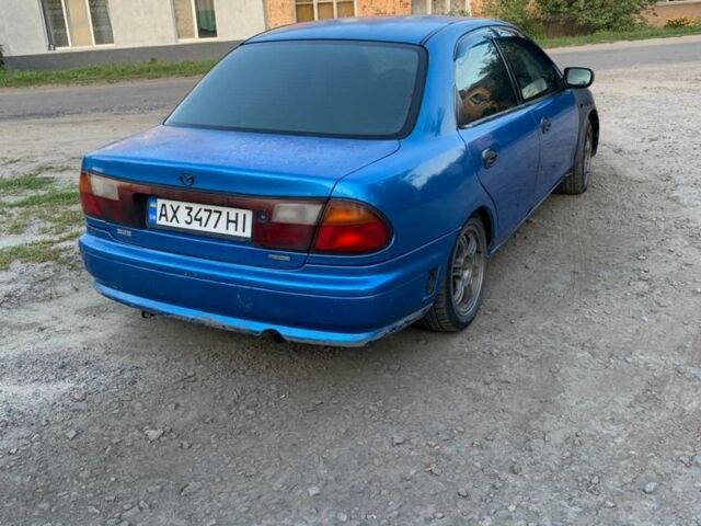Синий Мазда 323, объемом двигателя 1.8 л и пробегом 275 тыс. км за 784 $, фото 2 на Automoto.ua