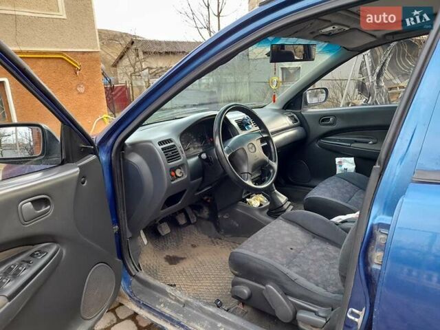 Синій Мазда 323, об'ємом двигуна 1.8 л та пробігом 238 тис. км за 3200 $, фото 3 на Automoto.ua
