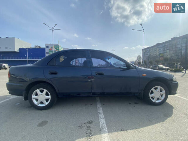 Синий Мазда 323, объемом двигателя 1.5 л и пробегом 330 тыс. км за 3000 $, фото 3 на Automoto.ua