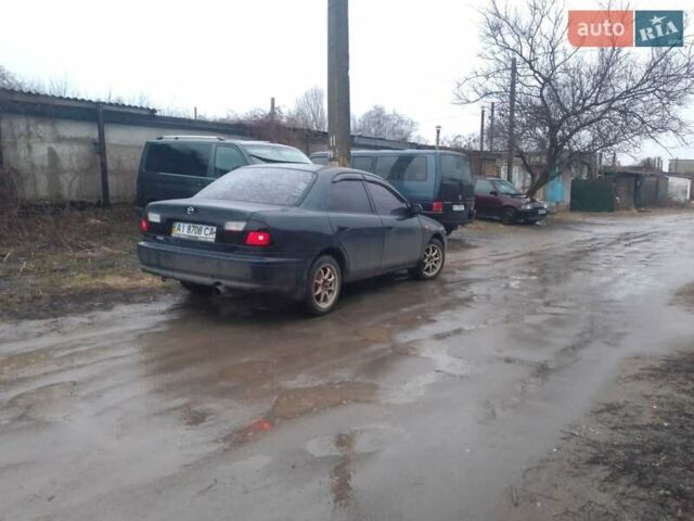 Синій Мазда 323, об'ємом двигуна 1.5 л та пробігом 309 тис. км за 2750 $, фото 4 на Automoto.ua