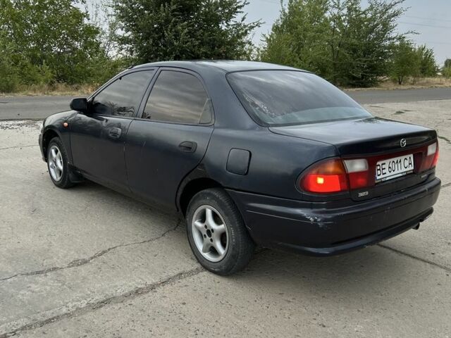Синий Мазда 323, объемом двигателя 1.5 л и пробегом 200 тыс. км за 1250 $, фото 2 на Automoto.ua