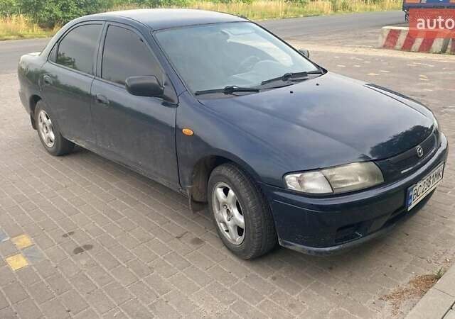 Синий Мазда 323, объемом двигателя 1.5 л и пробегом 430 тыс. км за 2200 $, фото 1 на Automoto.ua