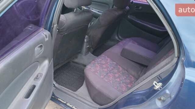 Синій Мазда 323, об'ємом двигуна 1.5 л та пробігом 70 тис. км за 1950 $, фото 9 на Automoto.ua