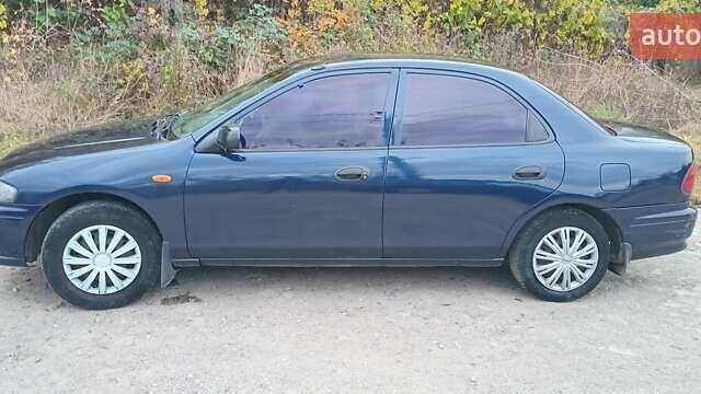 Синій Мазда 323, об'ємом двигуна 1.5 л та пробігом 70 тис. км за 1950 $, фото 1 на Automoto.ua