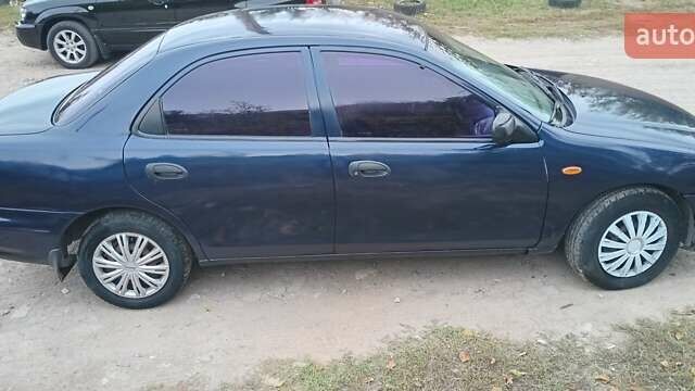 Синій Мазда 323, об'ємом двигуна 1.5 л та пробігом 70 тис. км за 1950 $, фото 4 на Automoto.ua