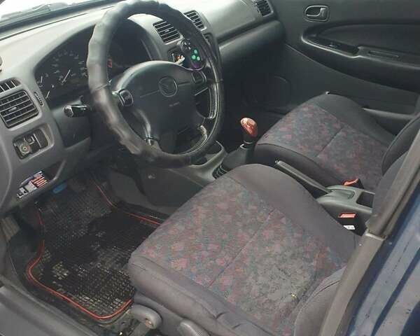 Синий Мазда 323, объемом двигателя 1.84 л и пробегом 299 тыс. км за 2000 $, фото 24 на Automoto.ua