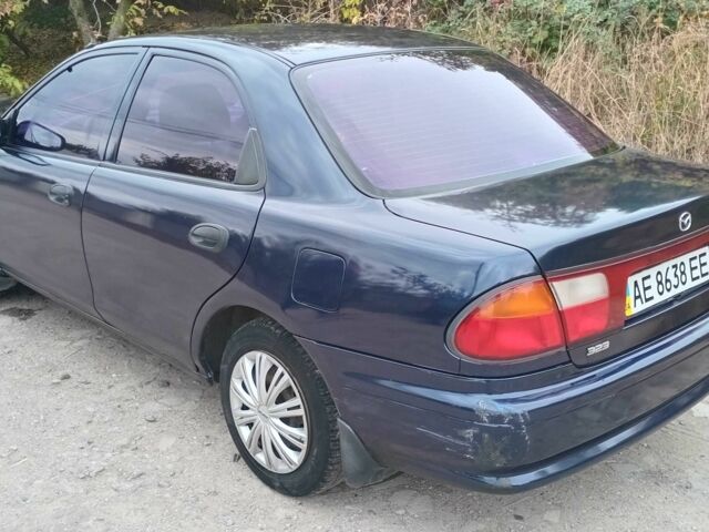 Синий Мазда 323, объемом двигателя 1.5 л и пробегом 74 тыс. км за 1950 $, фото 2 на Automoto.ua