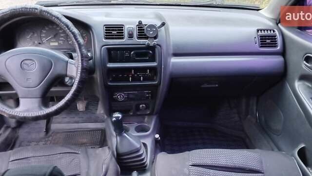 Синій Мазда 323, об'ємом двигуна 1.5 л та пробігом 70 тис. км за 1950 $, фото 7 на Automoto.ua