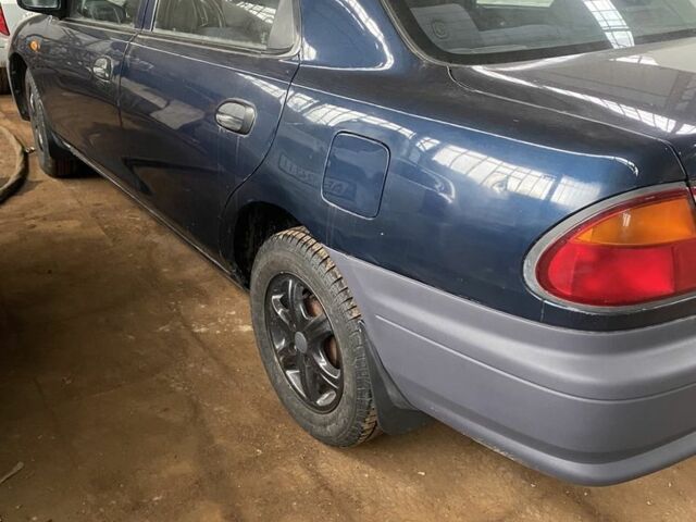 Синий Мазда 323, объемом двигателя 1.5 л и пробегом 260 тыс. км за 2620 $, фото 2 на Automoto.ua