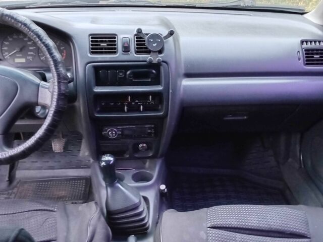 Синий Мазда 323, объемом двигателя 1.5 л и пробегом 74 тыс. км за 1950 $, фото 7 на Automoto.ua